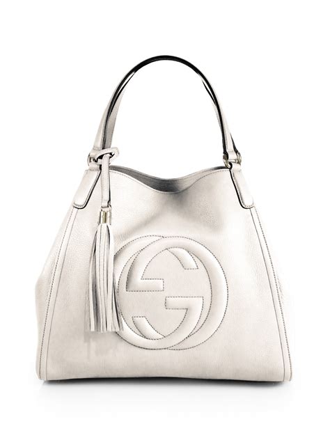 does saks sell gucci handbags.